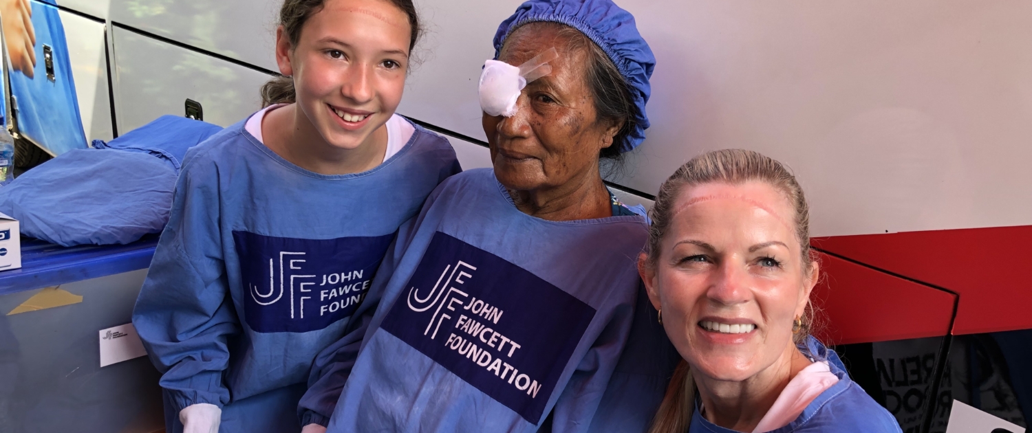 Lady and girl waiting with cataract surgery patient